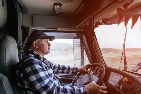 Driver in cabin of big truck